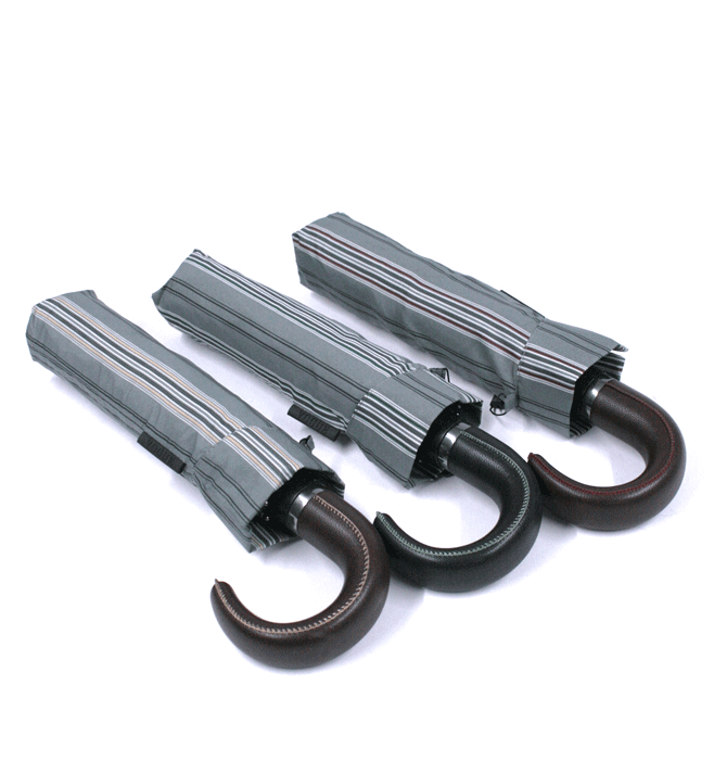 Paraguas plegable con funda, dibujo de rayas y mango de simil piel